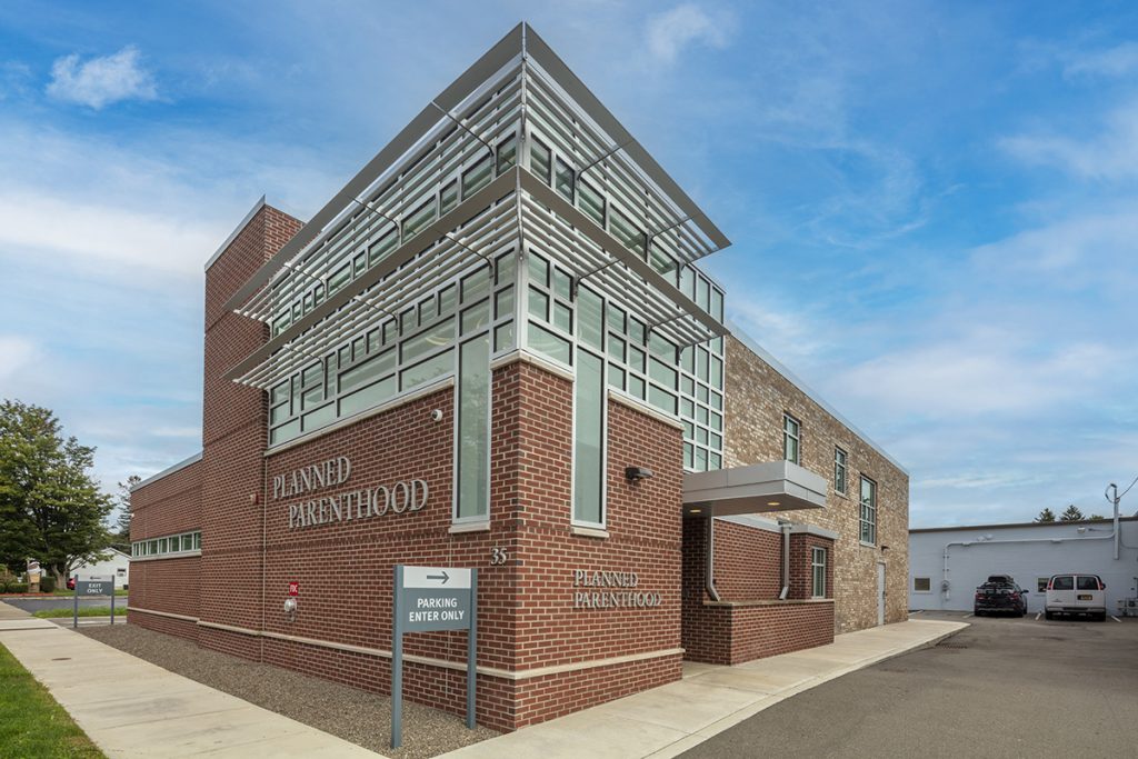 Renovated brick medical building with new glass enclosed stairwell