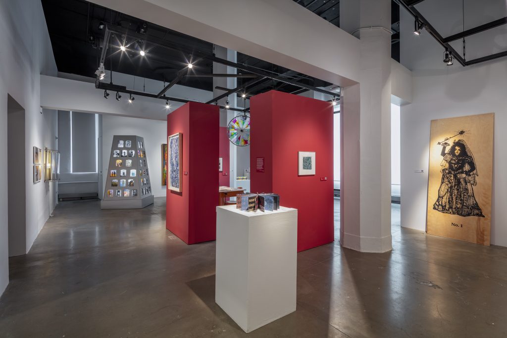 art gallery with red walls and feature art