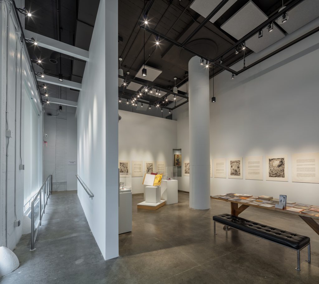 Art gallery with hanging wall art and ramp