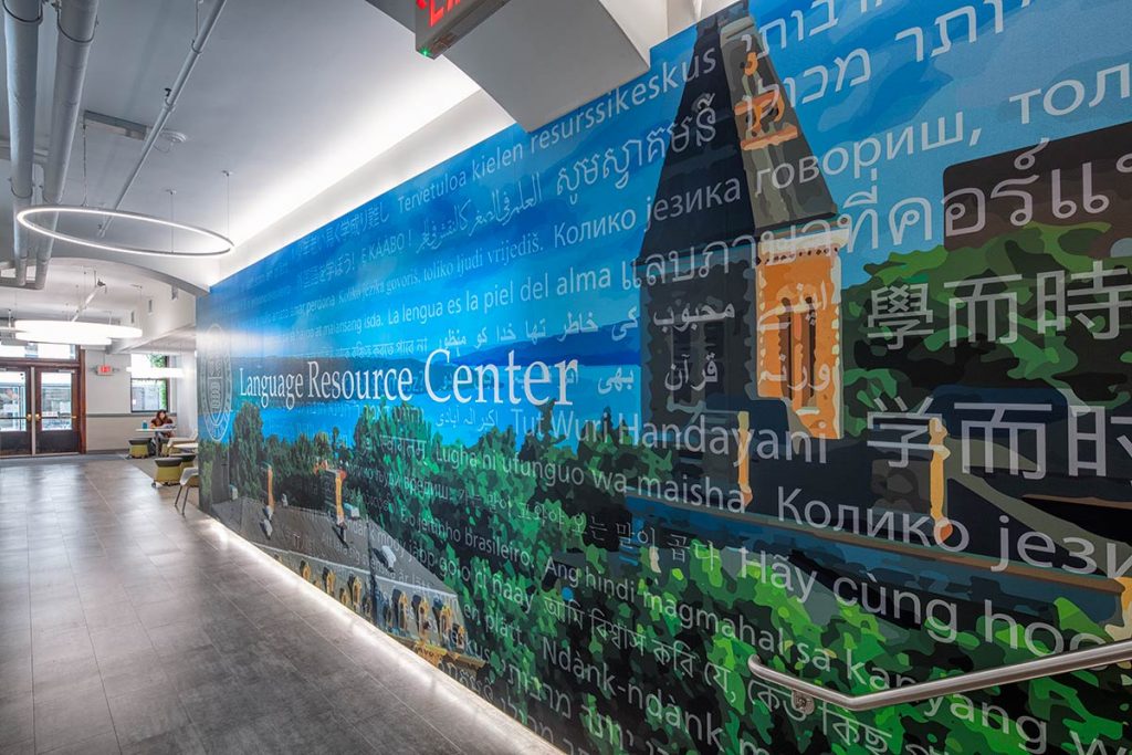 Bright university hallway with large-scale mural for wayfinding