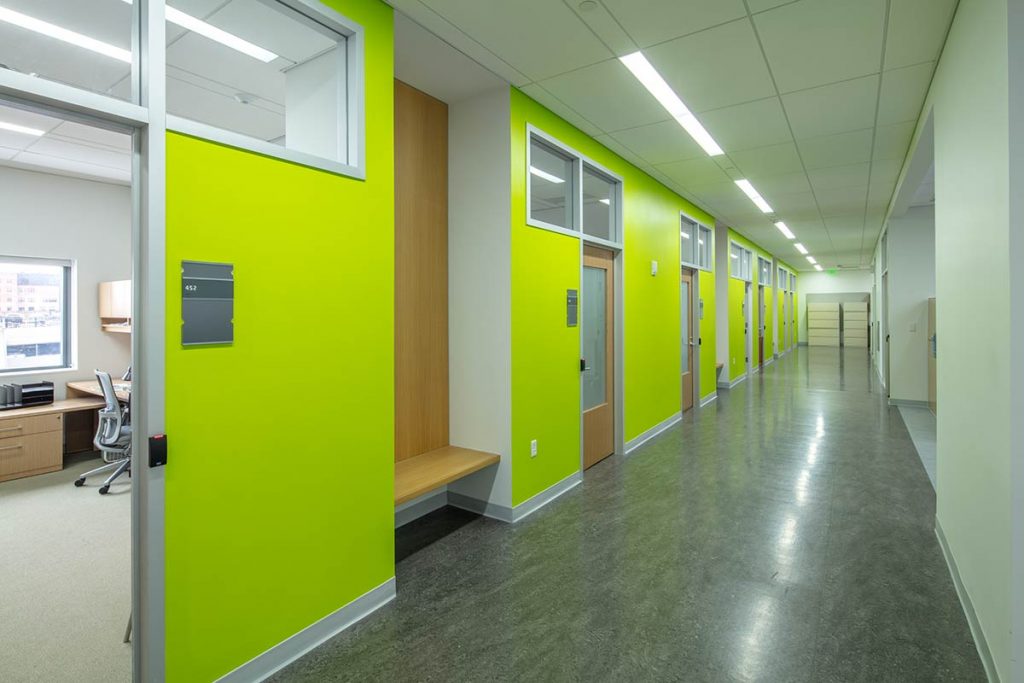 Renovated building with office, meeting rooms, and hallway following Universal Design principles.