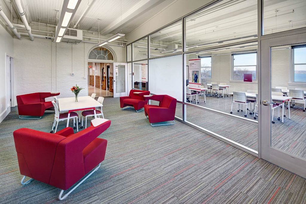 budget conscious renovations to older campus building with glass walls and dividers for flexible classrooms